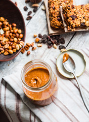 peanut butter homemade, and nuts on a light background