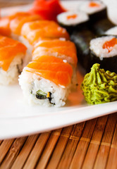 Roll with Cream Cheese and Cucumber inside. Salmon topped