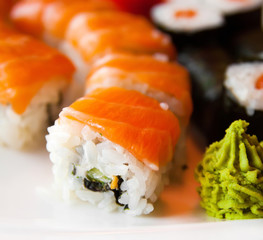 Roll with Cream Cheese and Cucumber inside. Salmon topped