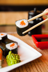 sushi keep chopsticks and dipped into the sauce
