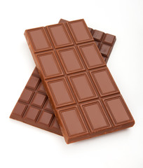 different sorts of chocolate in a stack on white background