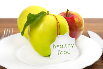dieting and health food. Yellow, green apple with leaf and white