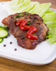 tasty grill meat with sauce and green on white plate