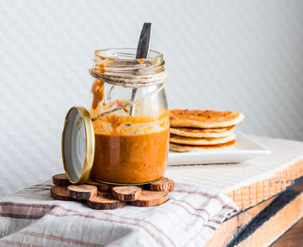 homemade peanut butter in a glass jar, eat a teaspoon