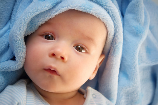 baby in blue blanket