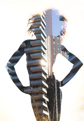 Double exposure of model posing and city building