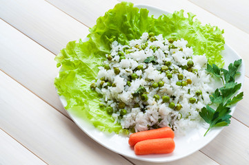 boiled rice with peas and greens
