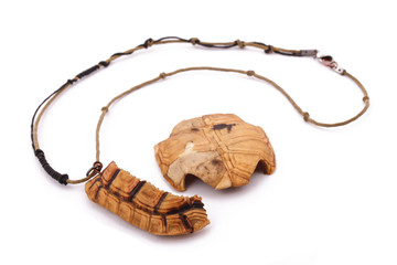 The turtle necklace on the white background
