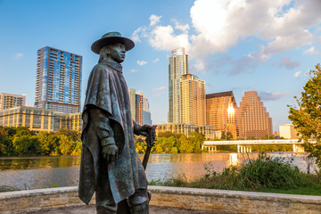 Stevie Ray Vaughan statue in front of downtown Austin and the Co