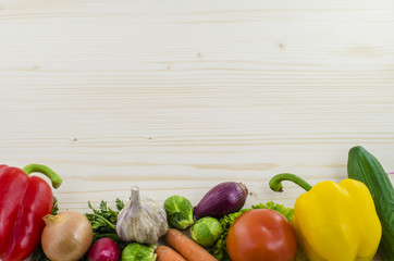 Wooden table with fresh vegetables. Background.