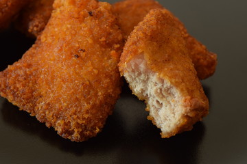 Plate of chicken nuggets with dip sauce.