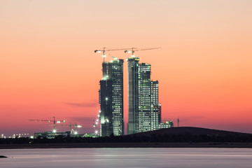 Construction site in Abu Dhabi at dusk. United Arab Emirates