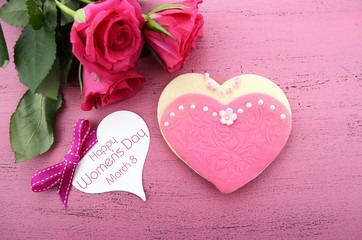 Heart shape cookies decorated as pink ladies dresses 