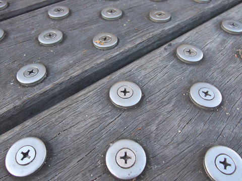 Closeup of wood flooring with metal anti slip