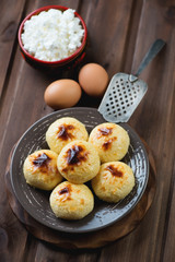 Homemade cottage cheese pancakes and ingredients, studio shot