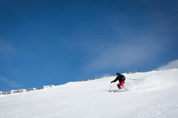 Fototapeta na wymiar Man sliding on ski