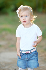 portrait of little girl outdoors in summer