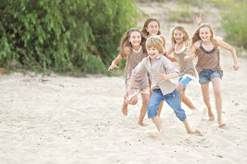 Portrait of children on the beach in summer