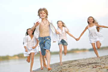 Portrait of children on the beach in summer