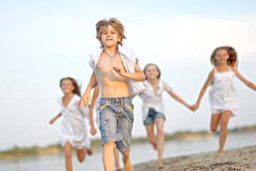 Portrait of children on the beach in summer