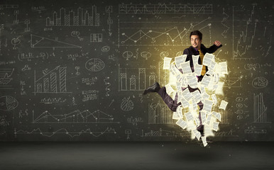 Handsome businessman jumping with paper document cloud