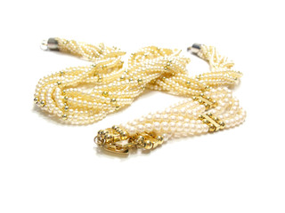 twisted strands of white pearls on a white background