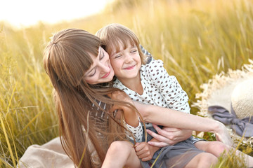 portrait of mother and daughter in nature