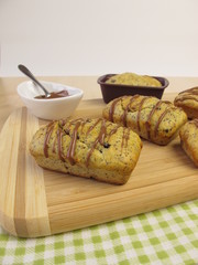 Small poppy seed cakes with chocolate coverture