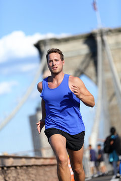 Man runner running on Brooklyn bridge in New York