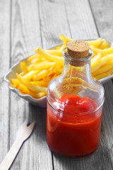 Ketchup on Glass Jar with Crispy French Fries