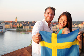 Swedish people showing Sweden flag in Stockholm