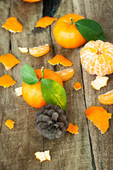 Tangerines with leaves on a wooden table