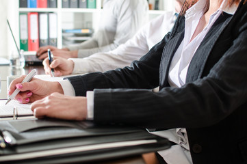 Business people taking notes