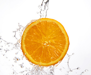 falling water and juicy orange
