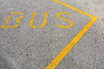 Bus sign painted on pavement