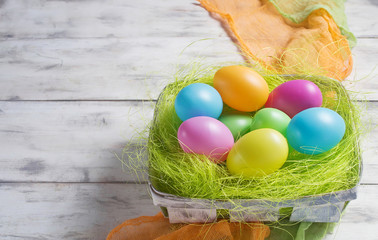 Basket with colored Easter eggs