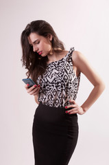 Fototapeta premium Pretty woman portrait with mobile