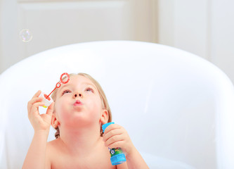 Cute little girl in the bathroom