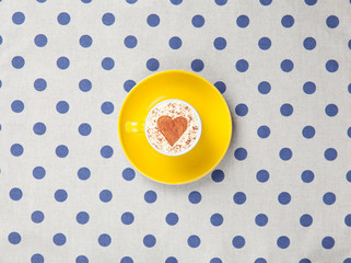 Cappuccino on polka dot background.