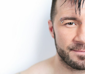 Fototapeta premium A sexy portrait of a man over a gray background