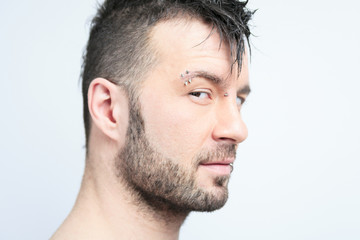 Obraz premium A sexy portrait of a man over a gray background