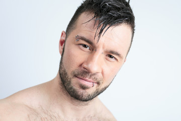 Fototapeta premium A sexy portrait of a man over a gray background