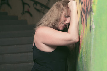 A woman having bad time in a tunnel