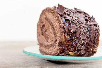 Chocolate cake slice on a transparent plate