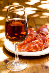 Glass of sherry with a snack (ham, jamon, parma).