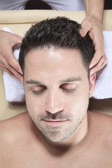 Obraz premium Man receiving Shiatsu massage from a professional masseur at spa
