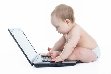 A Baby using laptop over white background