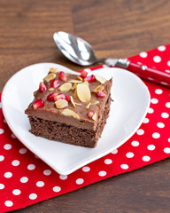 chocolate cake decorated with pomegranate and almond