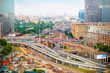 Fototapeta na wymiar Downtown Moscow. Roads with cars, building houses