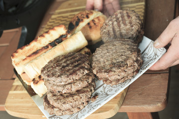 A BBQ with Hamburger, Bread and hot dog